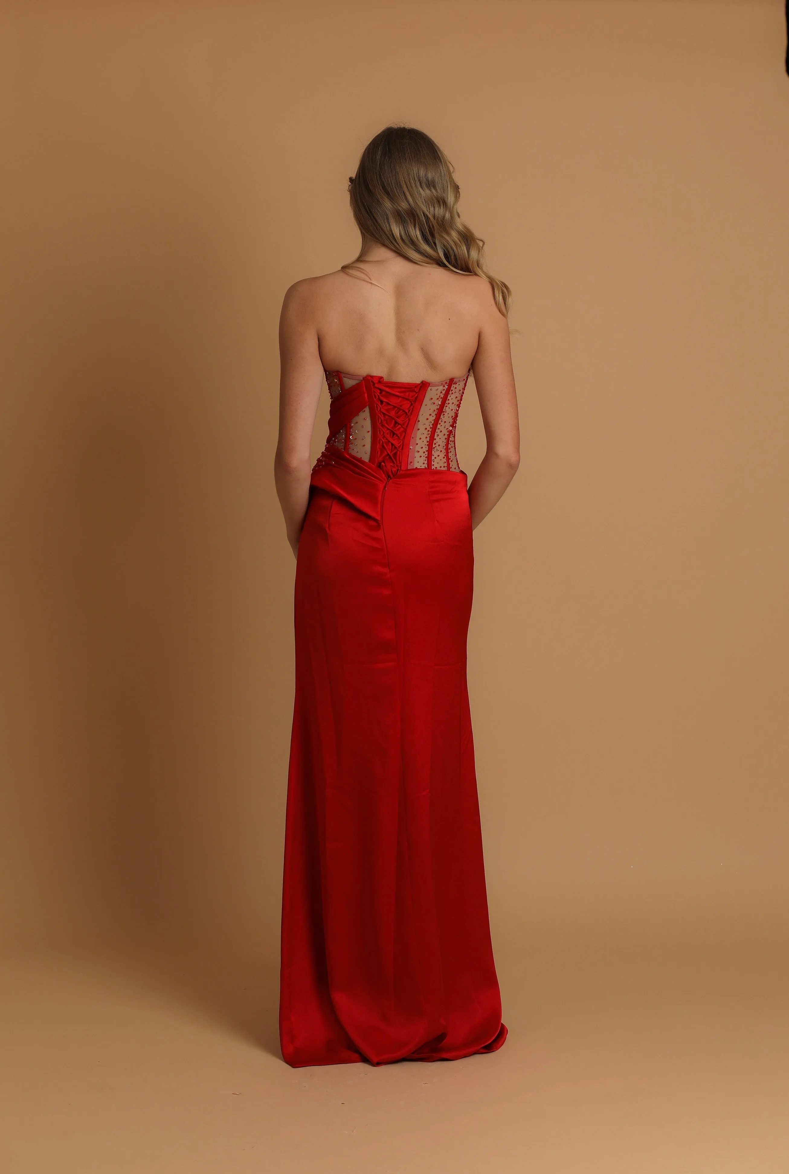 red high slit dress with corset back fore hire